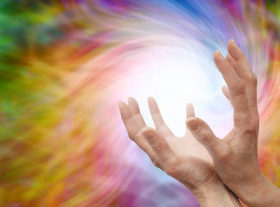 Hands sending coloured energy