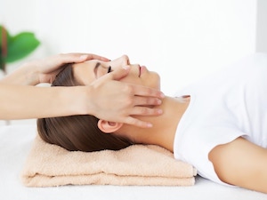 Woman receiving healing treatment